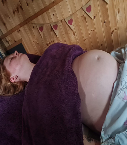 A client having a pregnancy massage